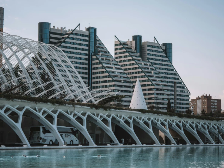 some tall buildings and bridge over the water