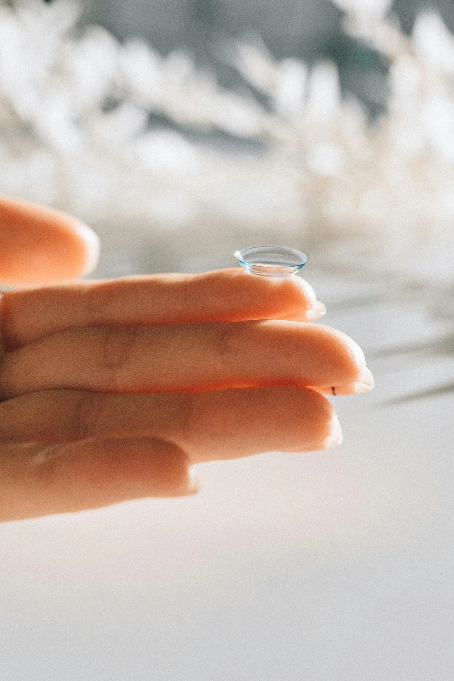 a close up s of a persons hand and ring