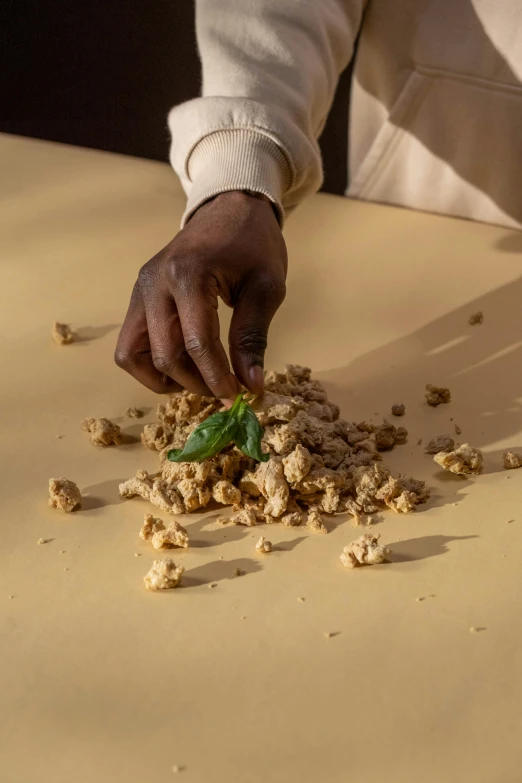 a person is picking food from a table