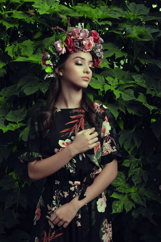 a woman with flowers in her hair is using her cell phone