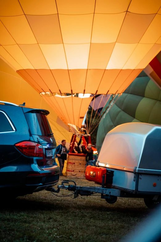 people and others are near a  air balloon