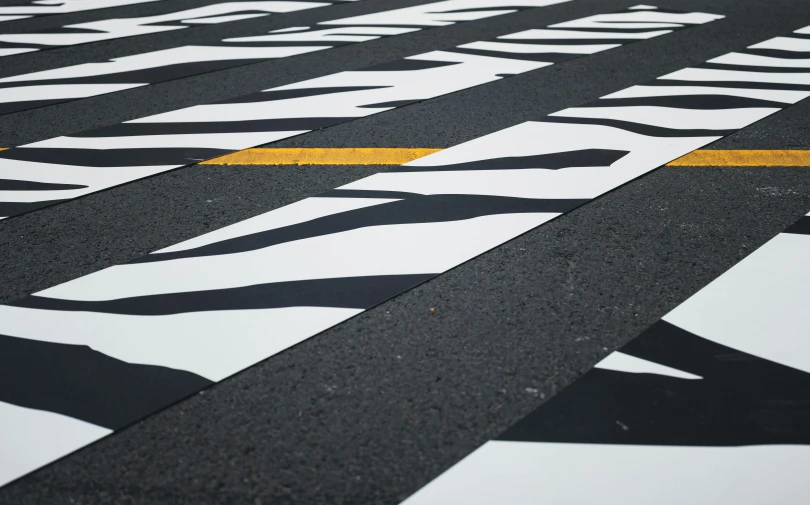 a street has yellow painted lines on it