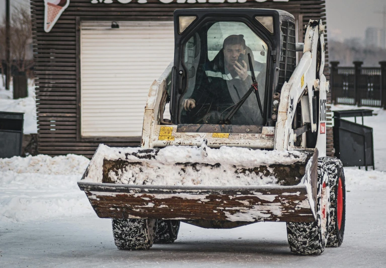 a large vehicle parked in front of a business