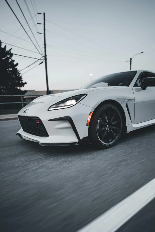 the toyota gr supra is parked along a street