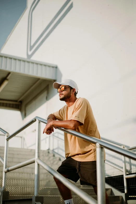 a person is sitting on the handrails and leaning on them