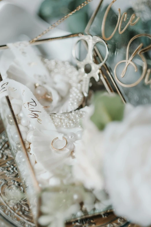 the details on this elegant table include pearls and rings