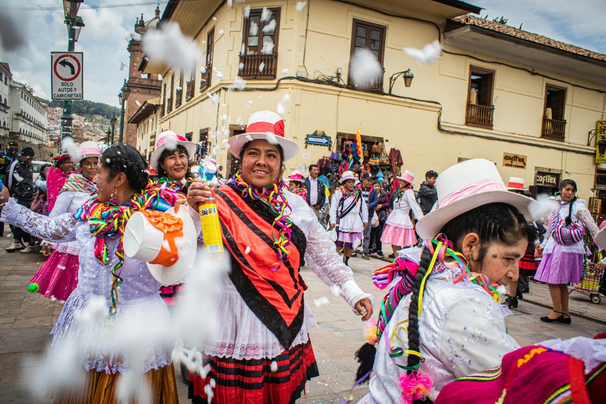 many people in dress clothes are walking in a parade