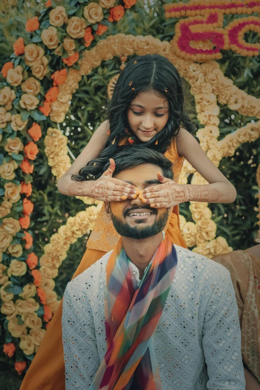 a woman holds the shoulders of her mans head