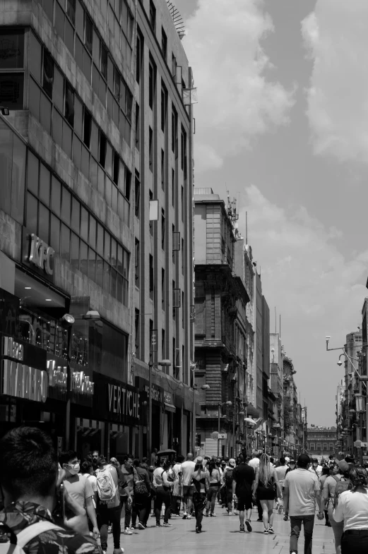 a group of people walking down the street