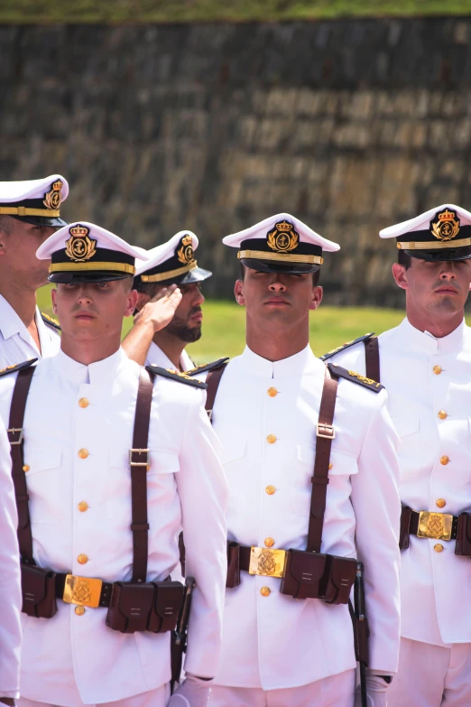 men in uniform are standing next to each other