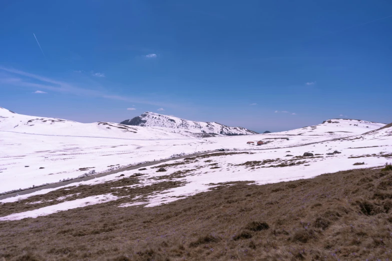 a group of mountain ranges that have snow on them