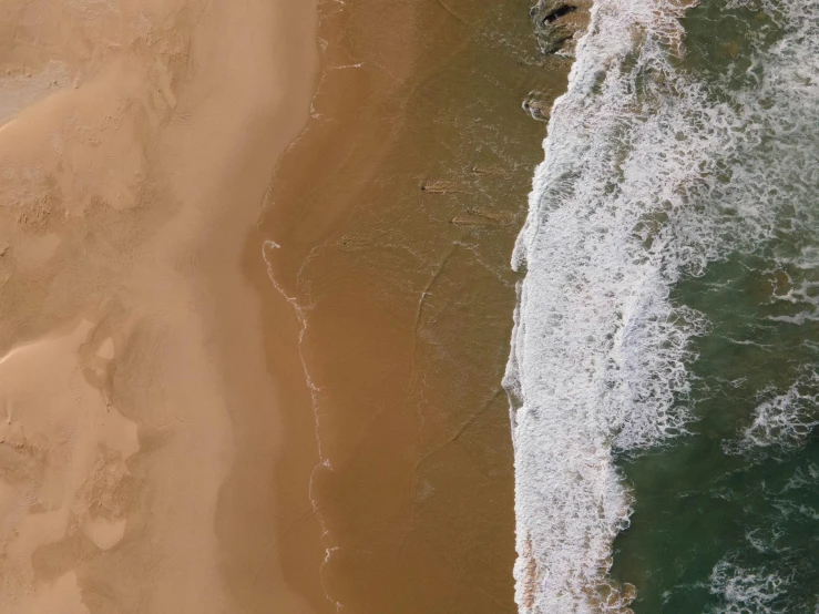 an aerial s of the beach and the water