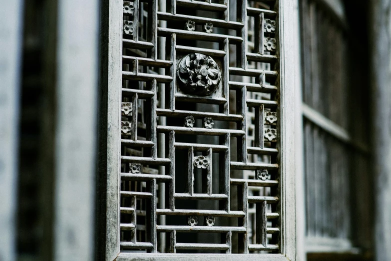 an antique looking decorative steel gate with an ornate design