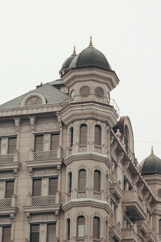 an old fashioned building in the snow