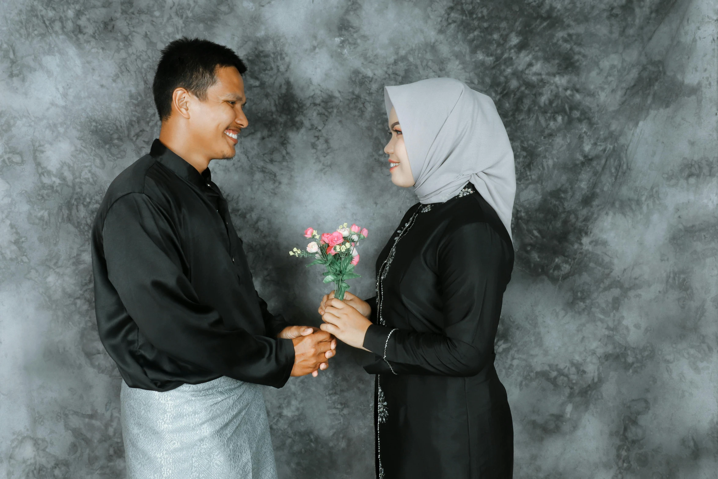 a couple exchanging vows and standing with each other