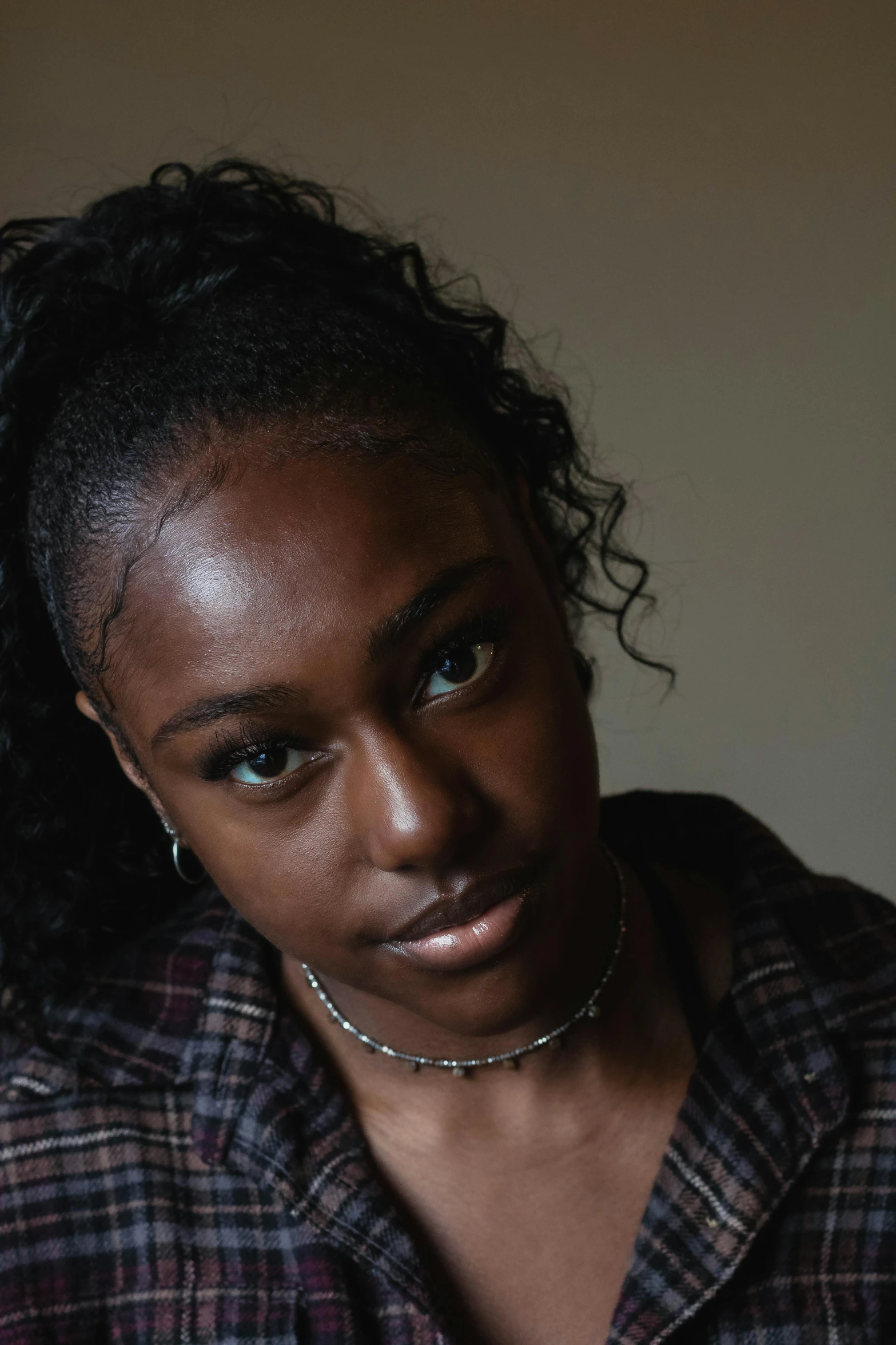 a young woman with freckles on her neck