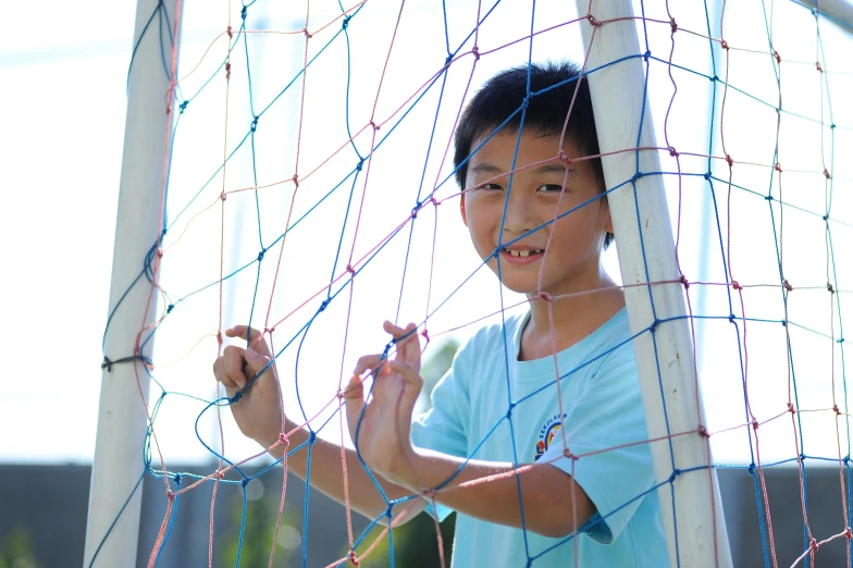 a  is painting a soccer net