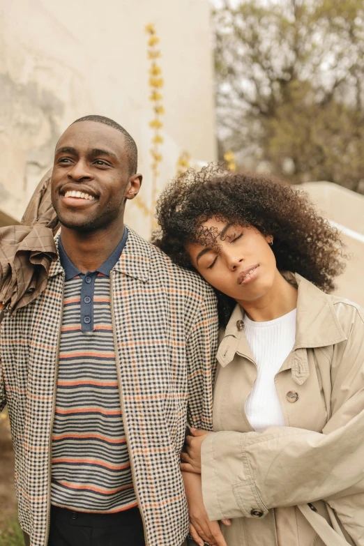 a smiling couple standing close to one another