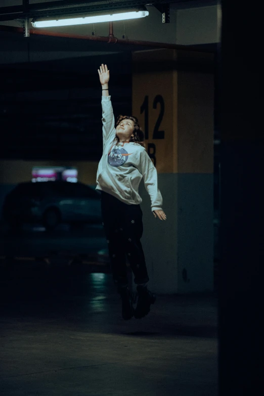 a boy in a white jacket and a skateboard