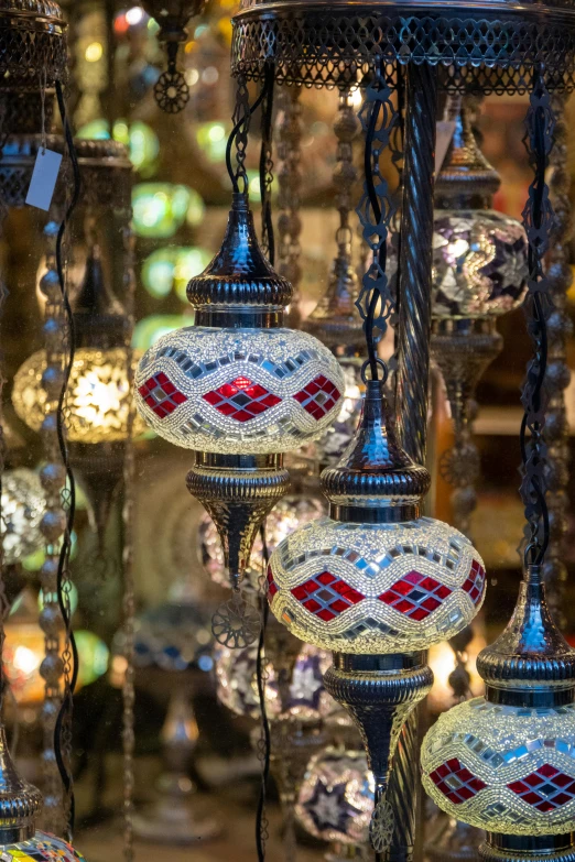 several glass lamps with various colors in a store