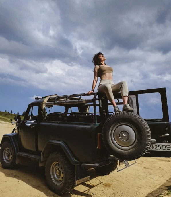 a  is sitting on top of a jeep