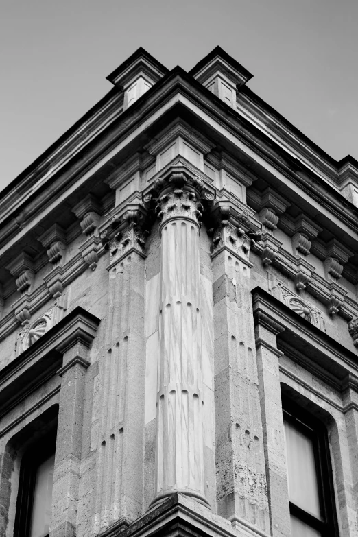 the architecture of a tall building in black and white