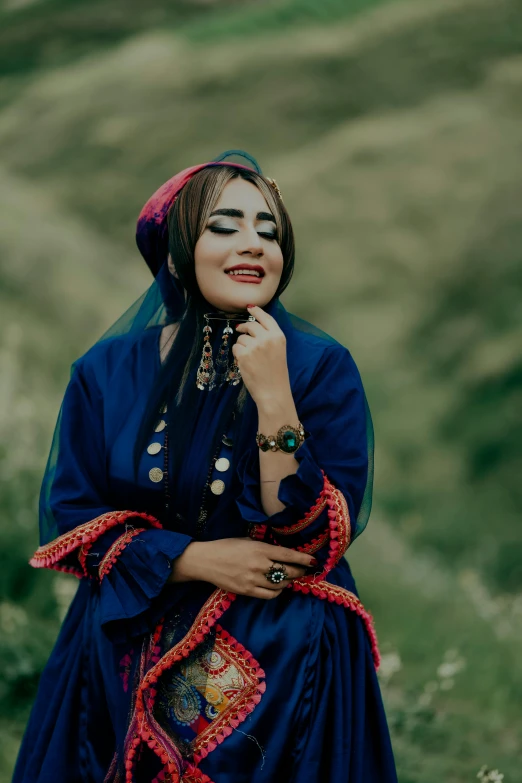 an indian woman in the field poses for a po