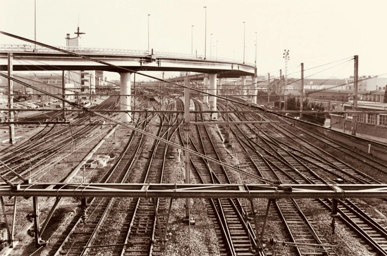 the trains are in the large city near many bridges