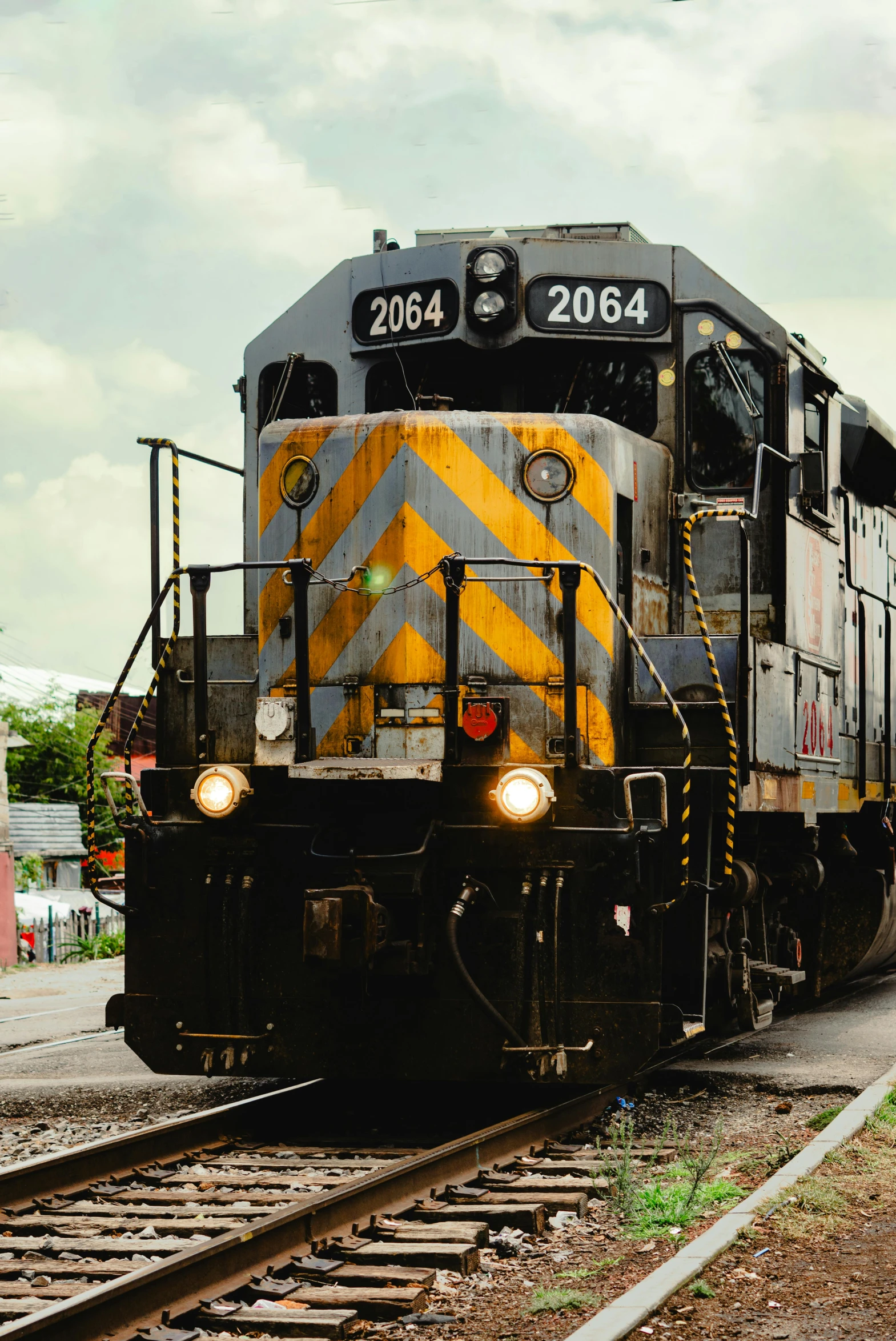 a locomotive train driving down the tracks by itself