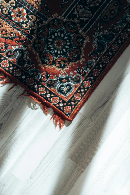 an oriental rug is laying on the floor