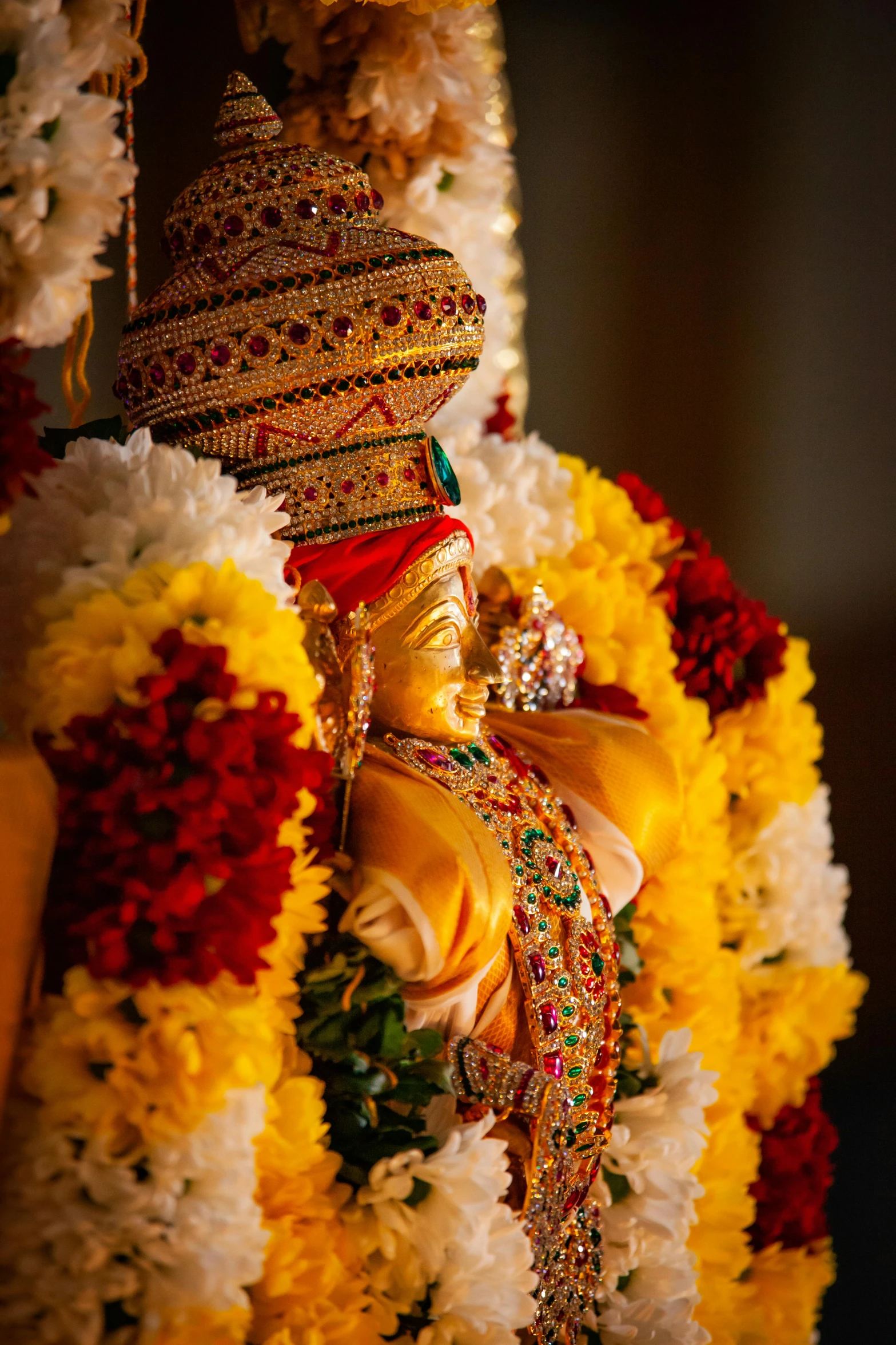 a statue made up with flowers and a light