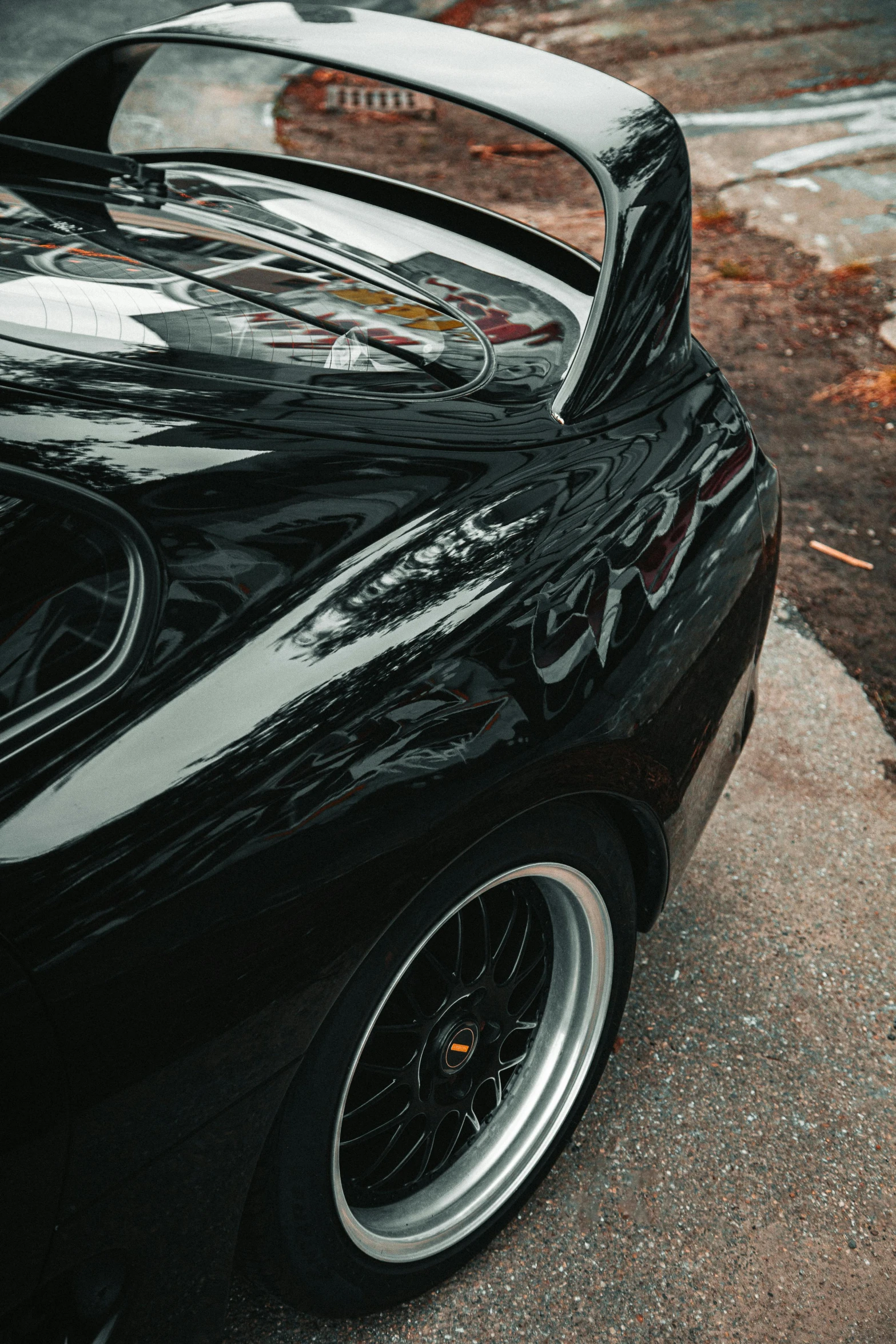 close up s of a black sports car parked on the street