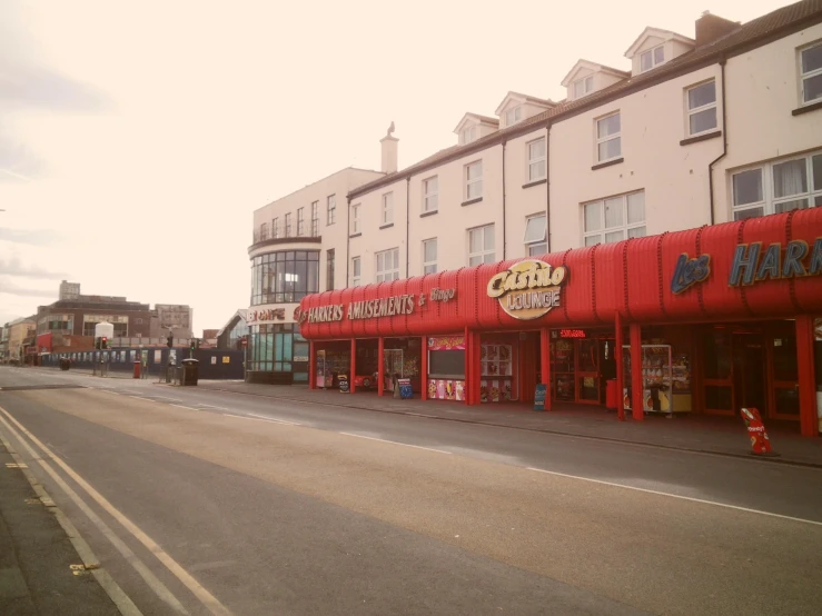 shops on the side of an empty road