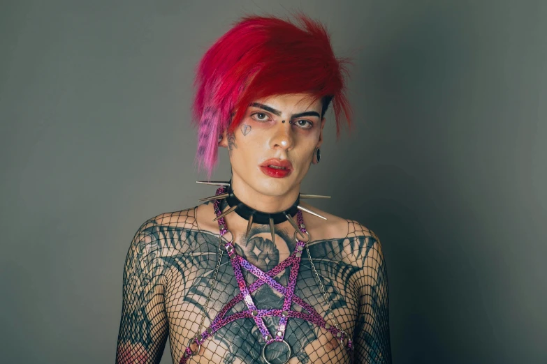 a young lady with red hair wearing elaborate tattoos