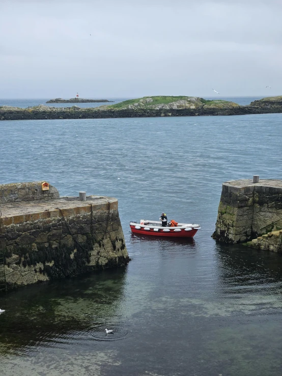 two people in a boat traveling through water