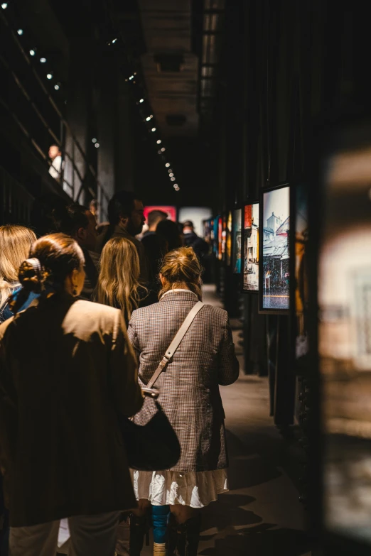 people are standing in line at the metro station