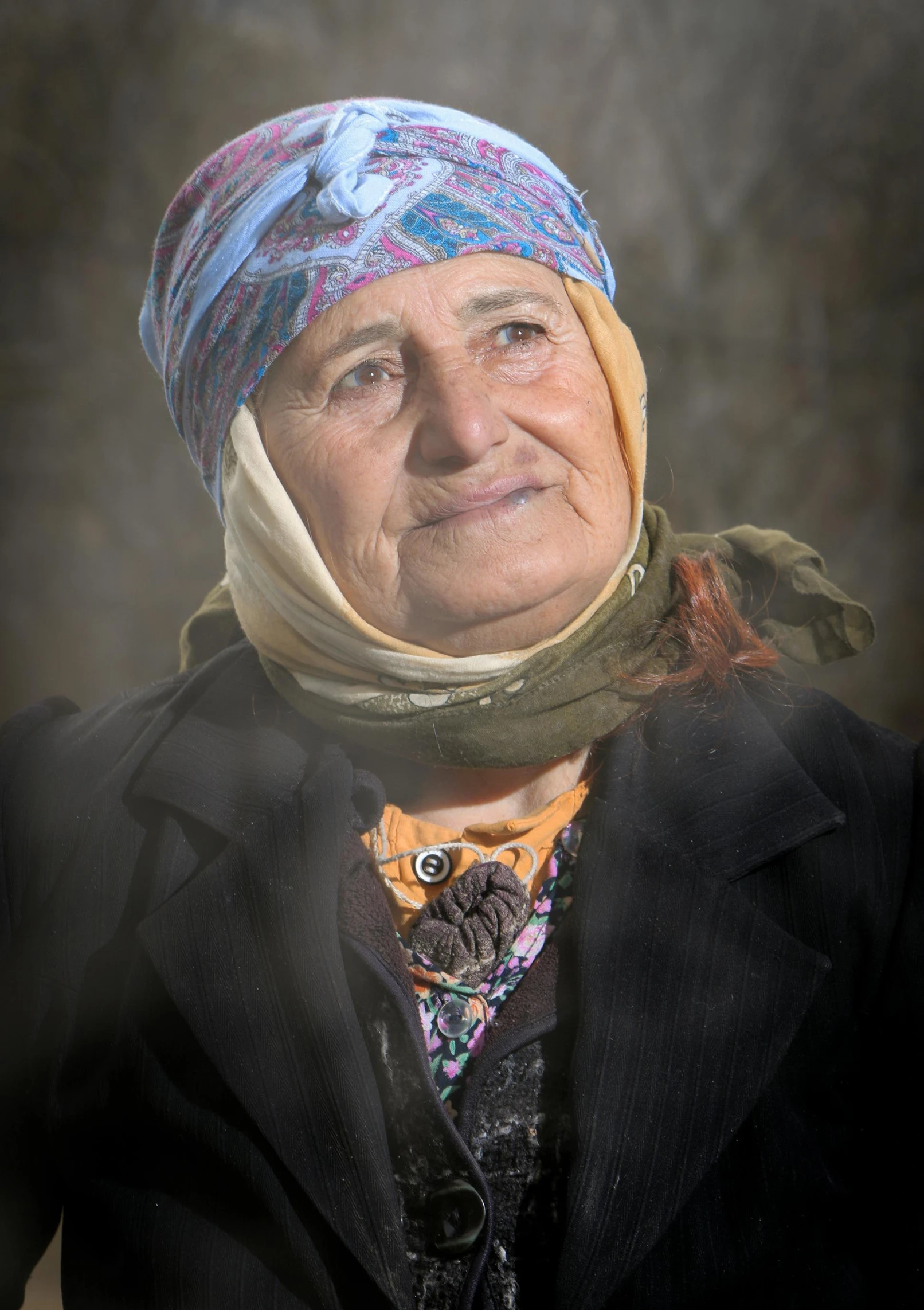 an old woman with a head wrap on