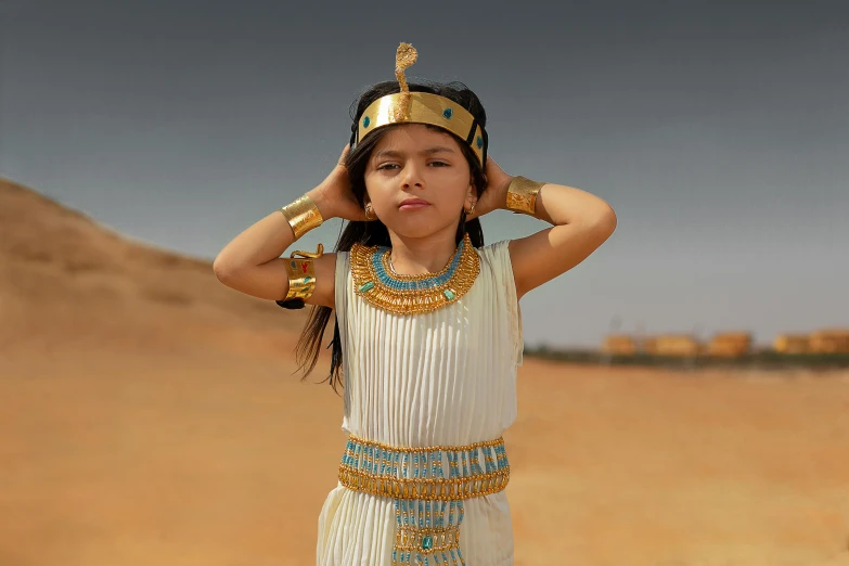 a  in an egyptian costume poses for a picture