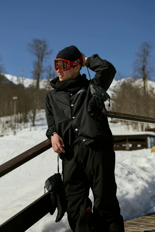 the man is posing with his ski gear on