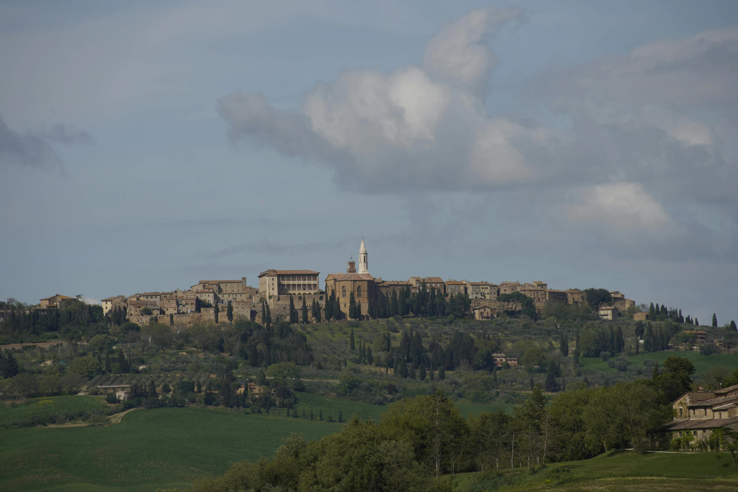 a very tall building on top of a hillside