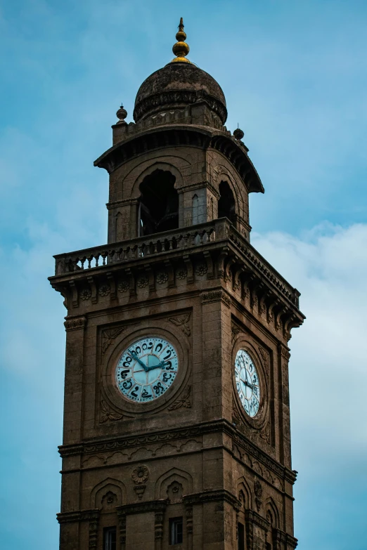 the clock tower is high up in the sky