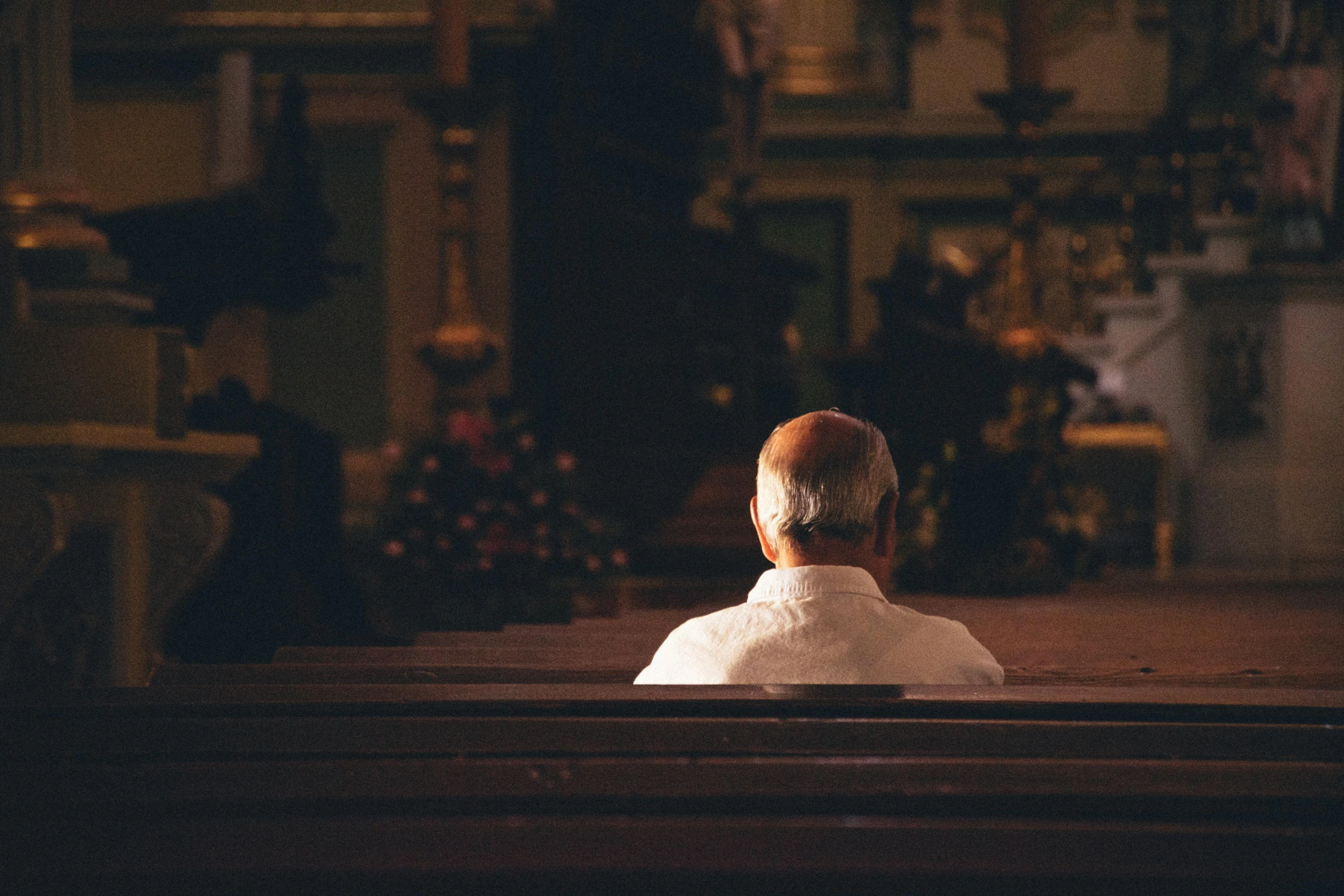 a bride sitting in a church looking out