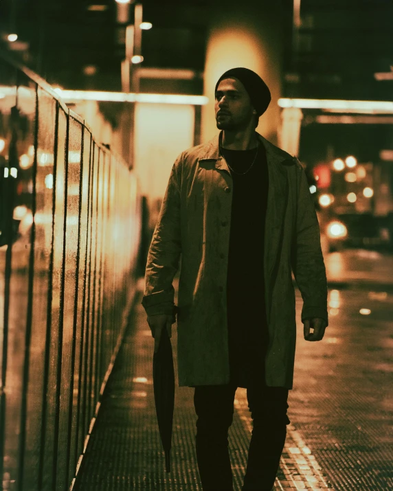 a man walking down a sidewalk next to traffic