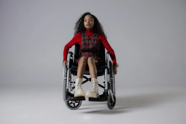 a woman in a wheelchair posing for a picture