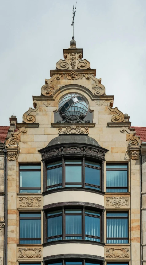 an ornate building with several windows and a steeple