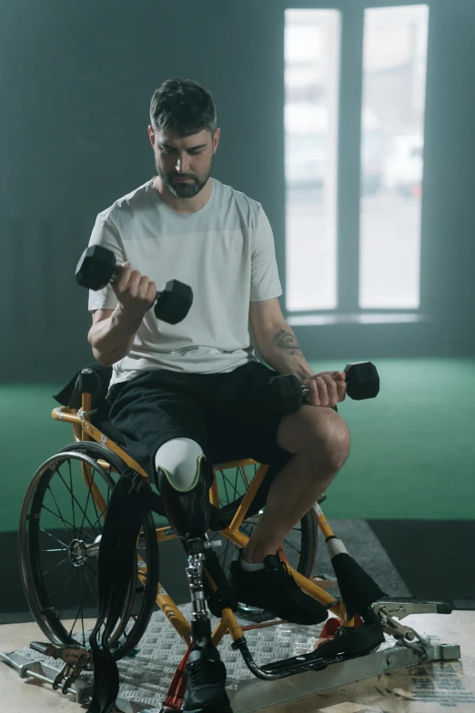 a man on a bike using two weights