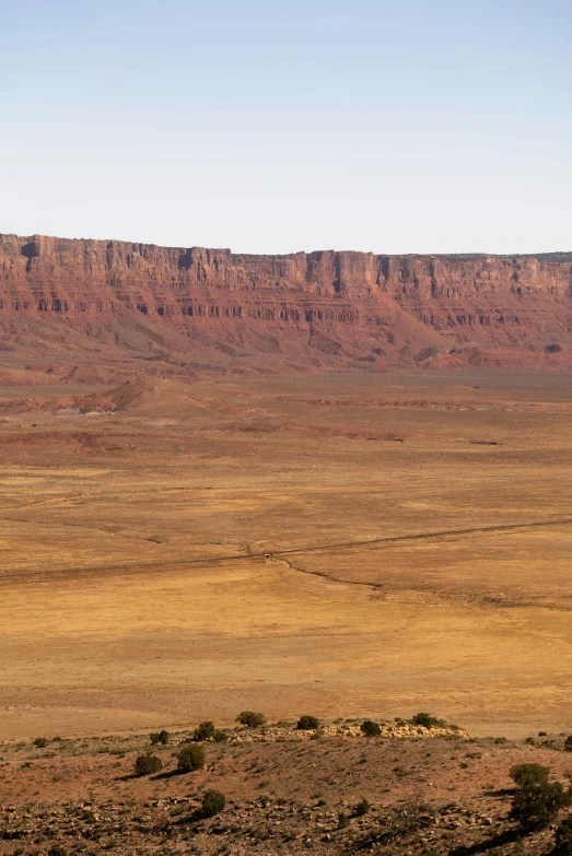 an open mountain range with sp desert terrain