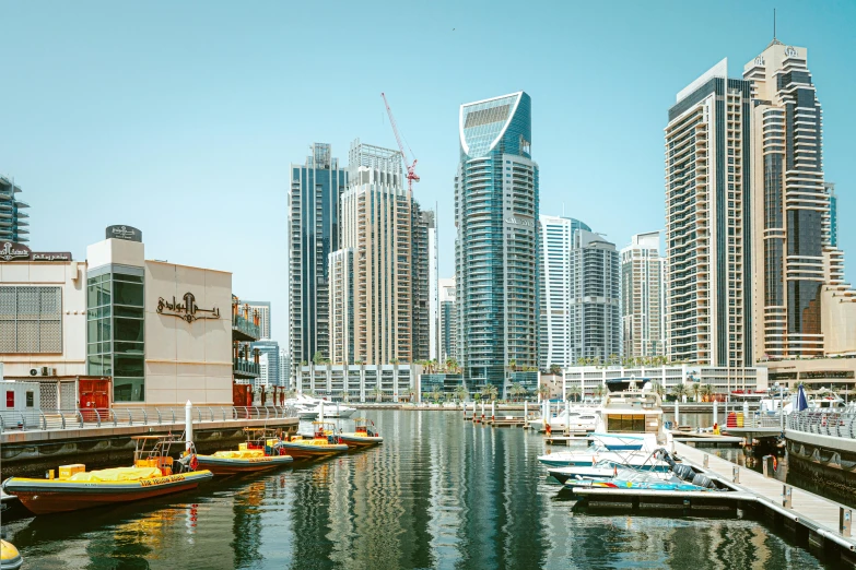 boats in the water by some buildings