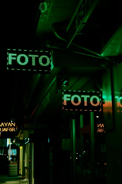 street signs with green lights that say poo