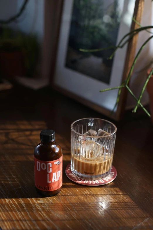 a glass cup on top of a wooden table